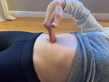 pelvic floor specialist assessing for diastasis abdominal separation postpartum